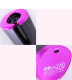 Cordless hair curler showing LCD display and temperature controls