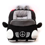 Small dog resting inside red car-shaped pet nest — cosy plush pet bed lifestyle shot